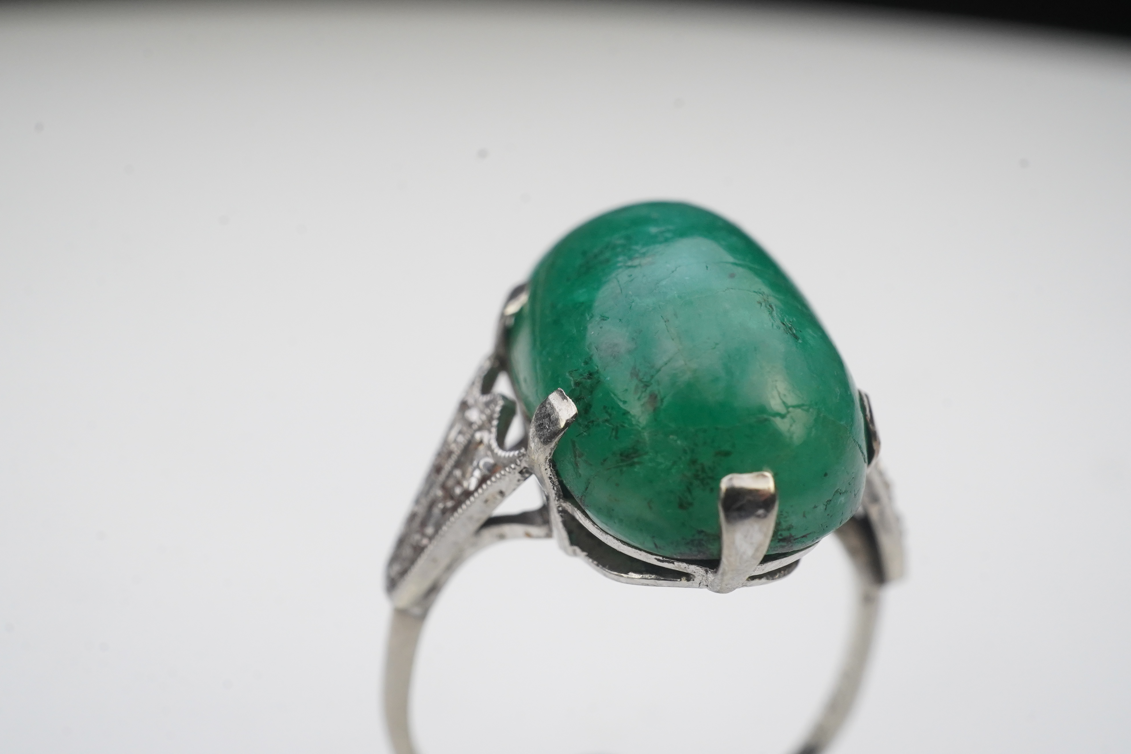 An emerald and diamond ring, early 20th century